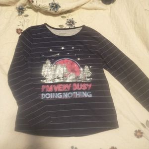 dark blue striped shirt. ¾ length sleeves, i'm very busy doing nothing